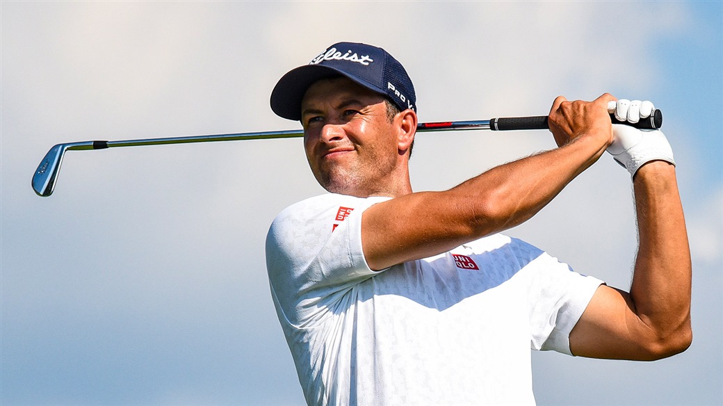 Adam Scott watches his Pro V1 golf ball fly towards the green during action at the BMW Championship