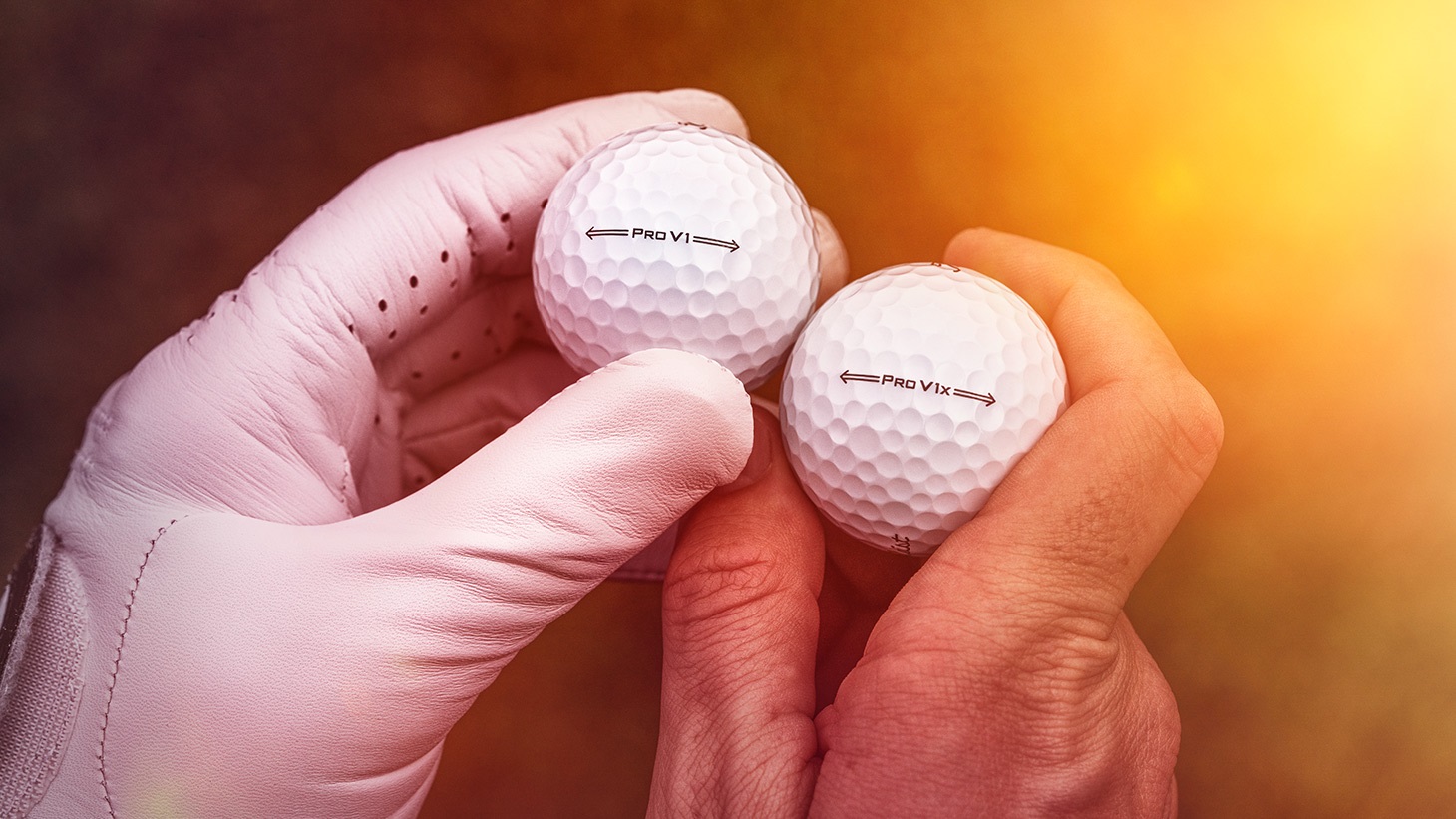 A golfer compares new Titleist Pro V1 and Pro V1x golf balls