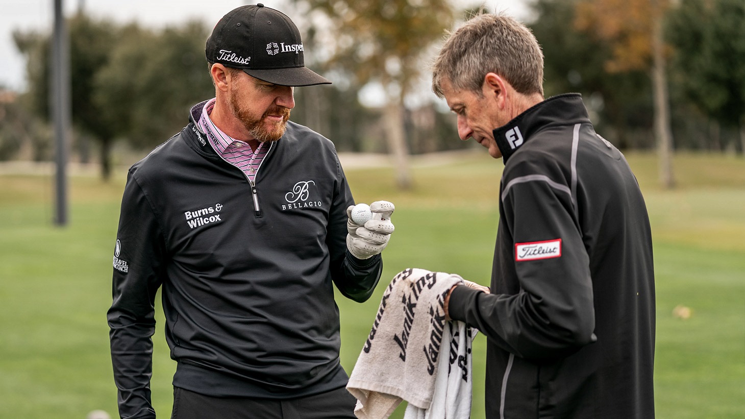 Jimmy Walker examines a new Pro V1x golf ball prototype during testing with Fordie Pitts, Titleist Tour Consultant for Golf Ball R&D